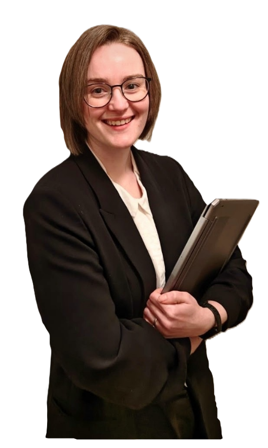 Photo of Jorviq owner, Yvette holding a laptop and smiling at the camera